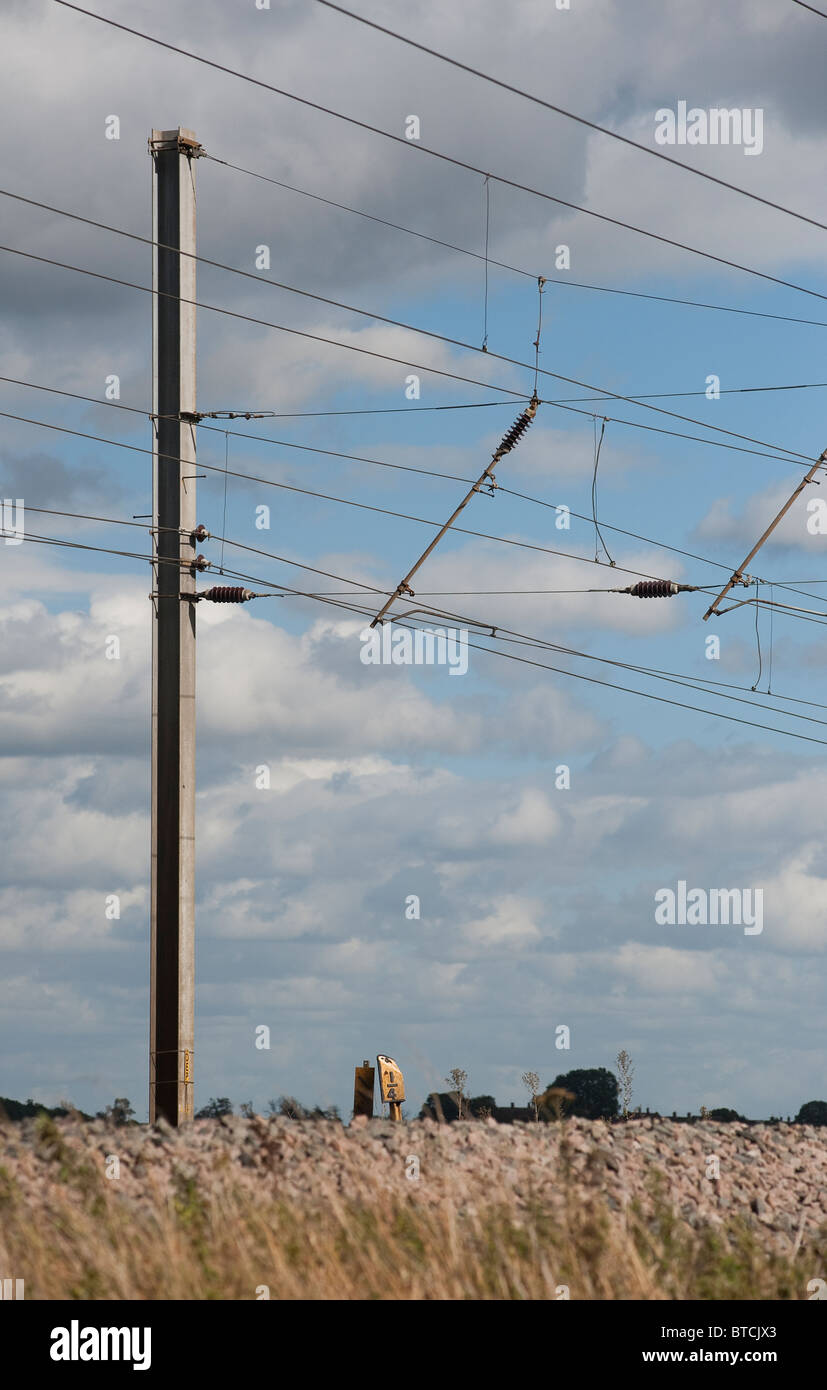 Electrified overhead lines over railway track on the midland main line, England. Stock Photo