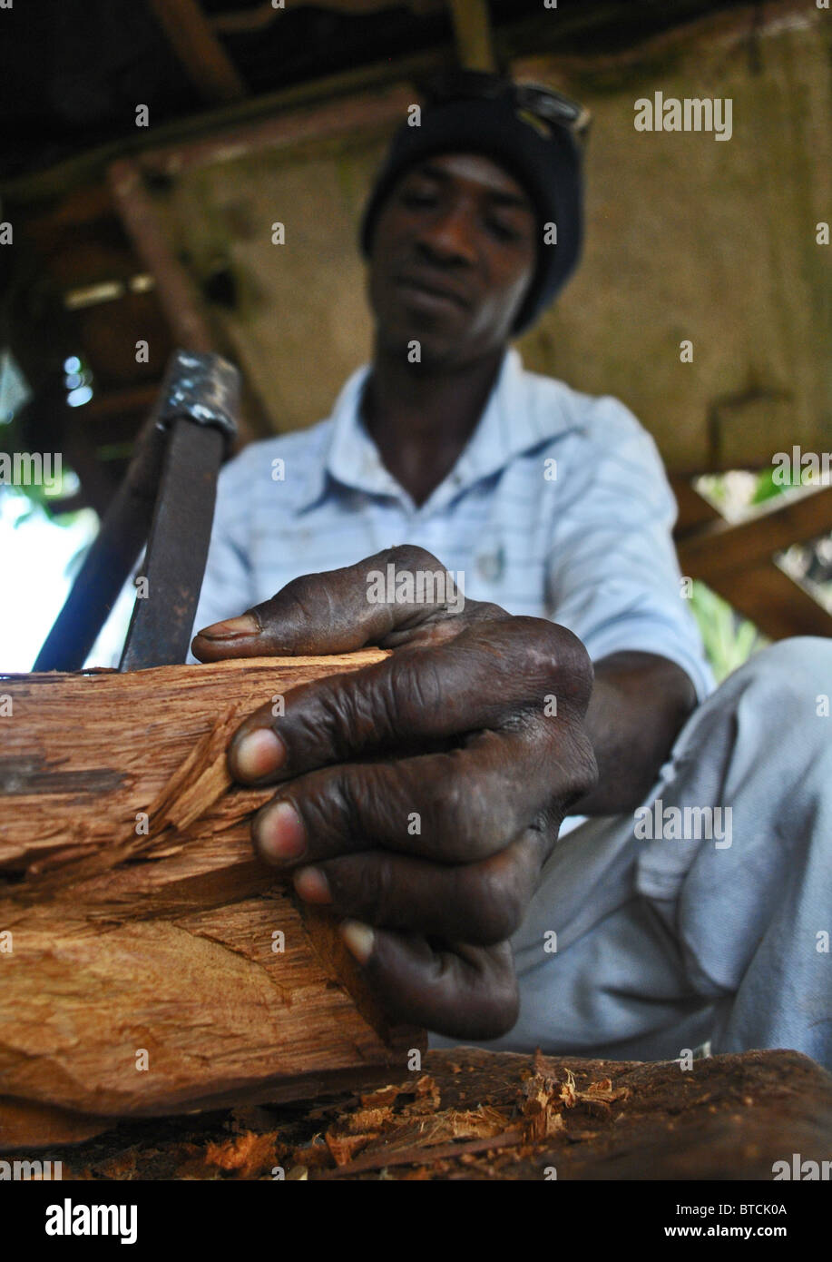 Craftsman making carvings in Ivory Coast, West Africa Stock Photo Alamy