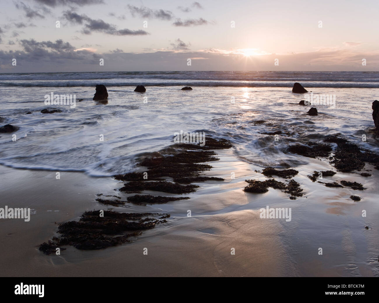 Sunset at Sandy Mouth beach near Bude, Cornwall, UK Stock Photo