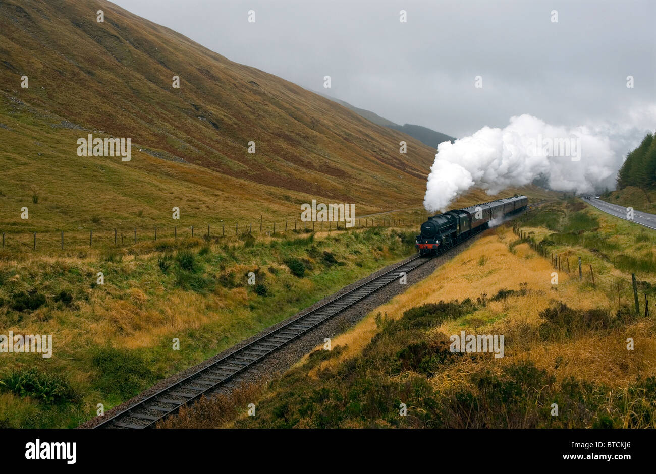 Steam Train Locomotive 44871, the 'Black 5' built in 1948 and one of the best known enthusiasts trains, climbing out of Tyndrum Stock Photo