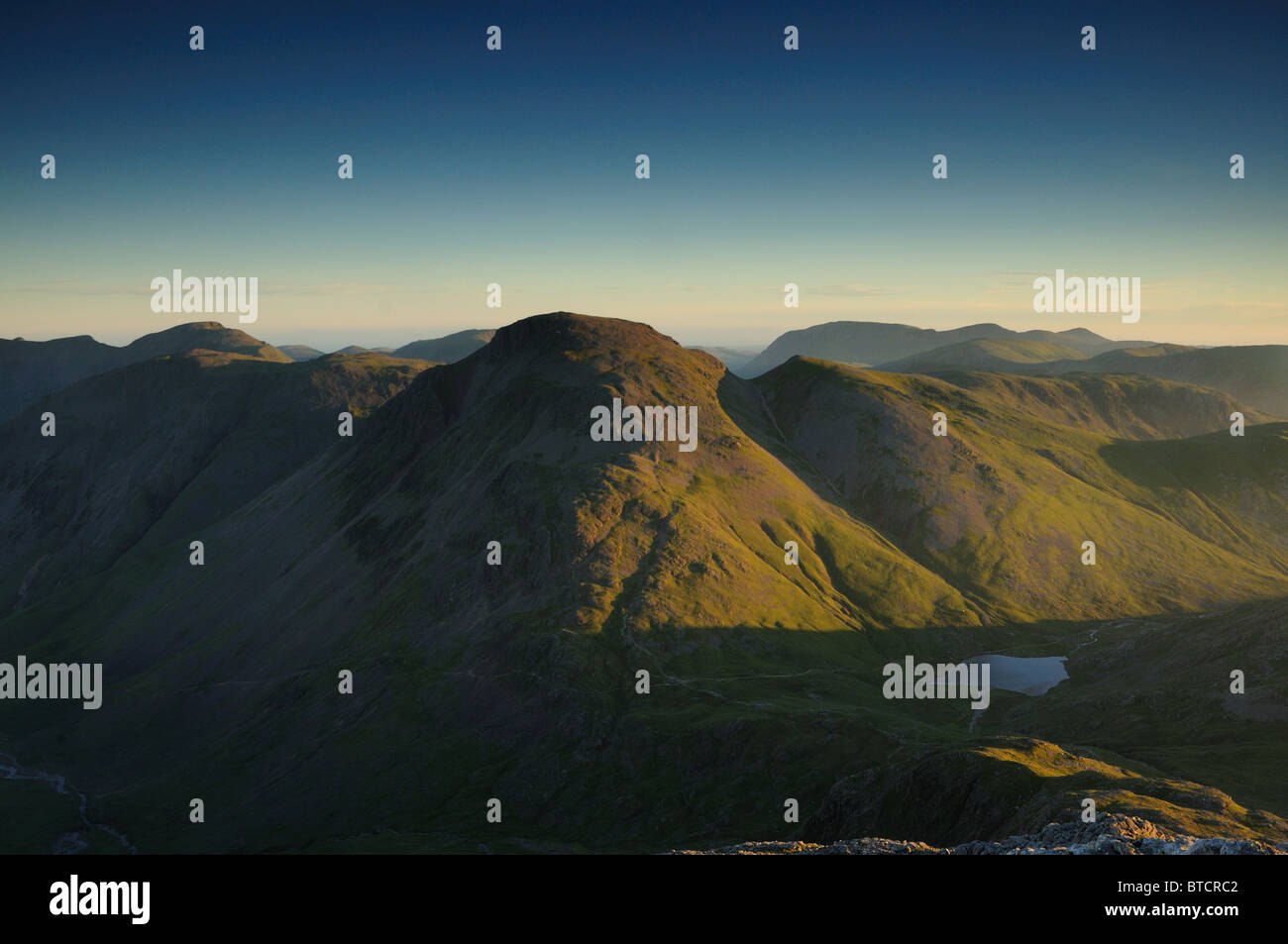 Dawn sunlight on Great Gable, mountain in the English Lake District Stock Photo