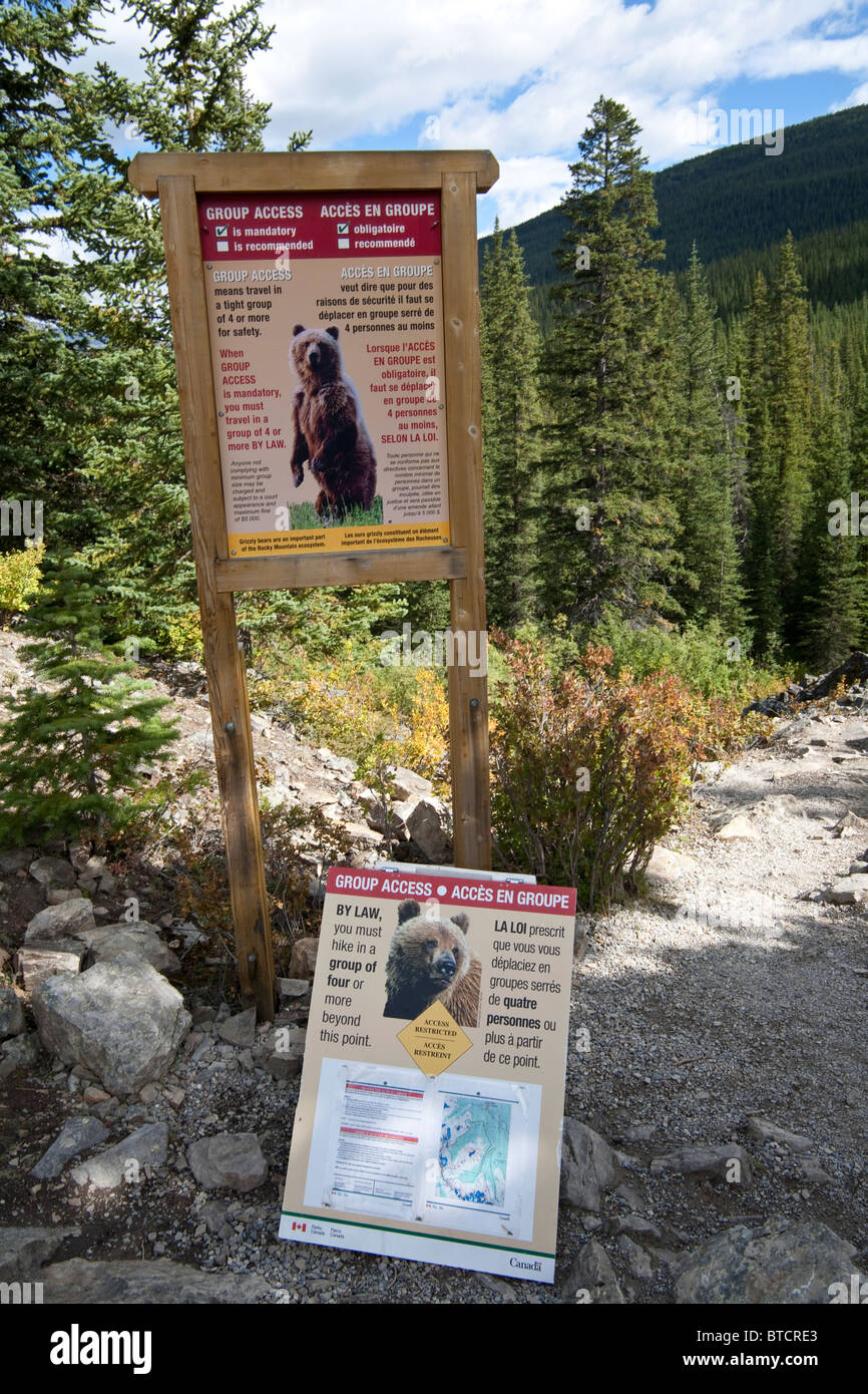 Group access warning sign against bear attack, lake Moraine, Rocky Mountains, Canada Sept 2010 Stock Photo