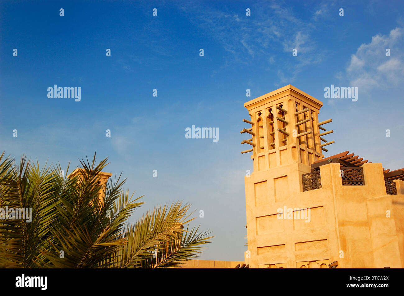 Arabic wind tower during sunset, Dubai, UAE Stock Photo