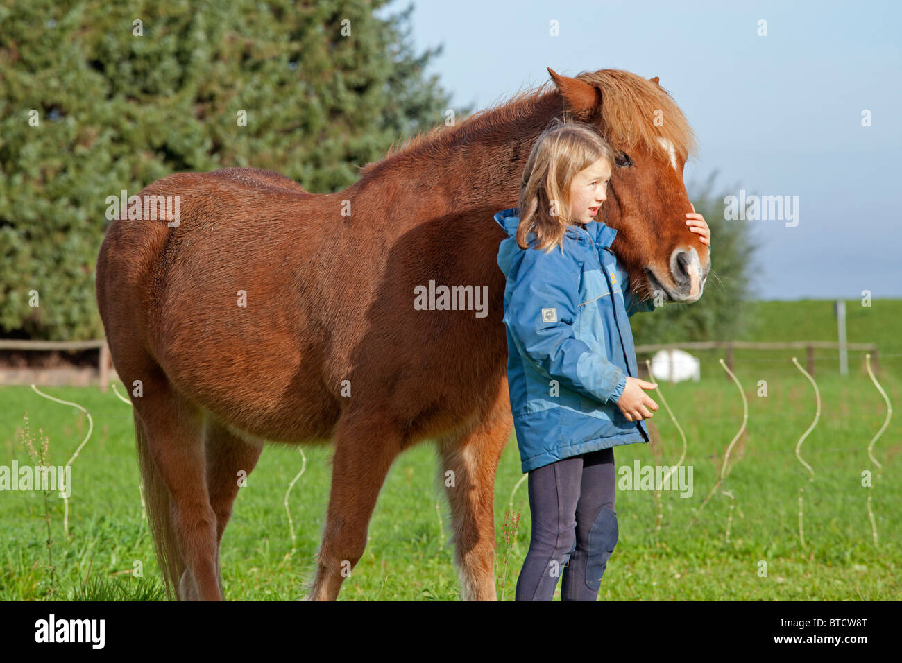 portrait of a little girl with a pony Stock Photo