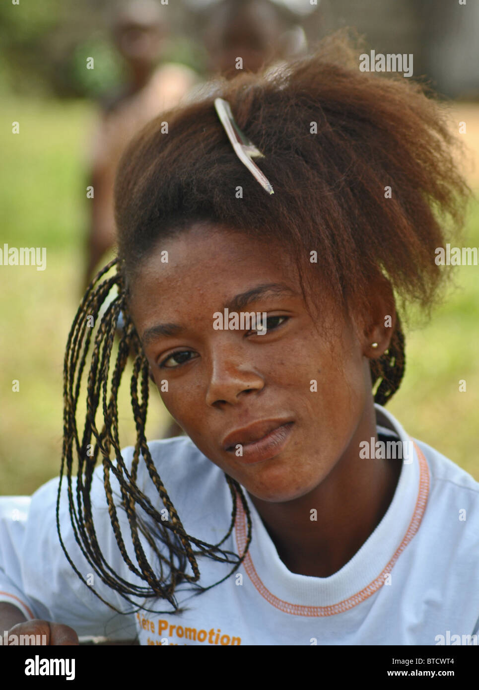 Teen Girl Getting Hair Braided In Ivory Coast West Africa Stock