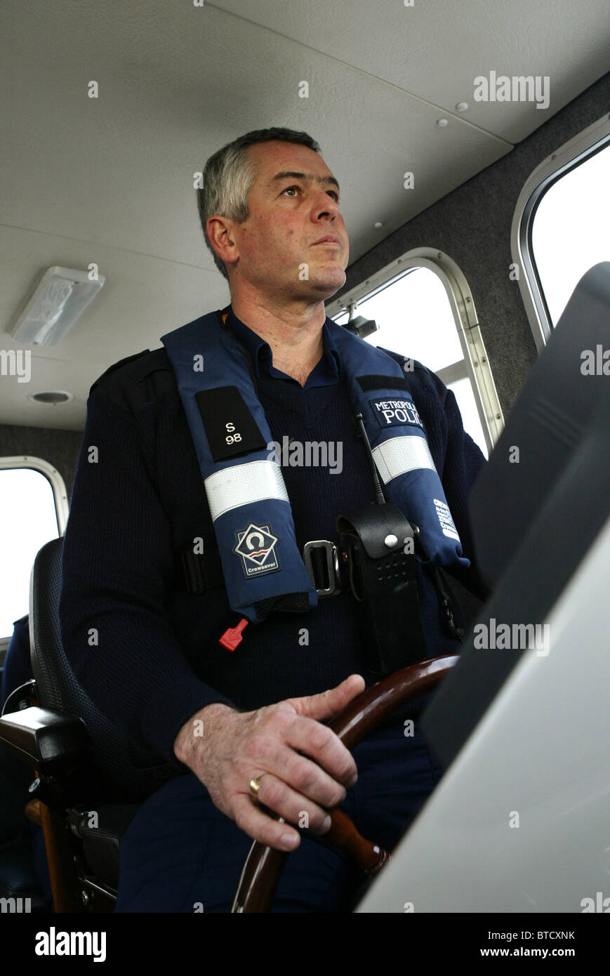 Metropolitan Police Officer from the Marine Policing unit on the river