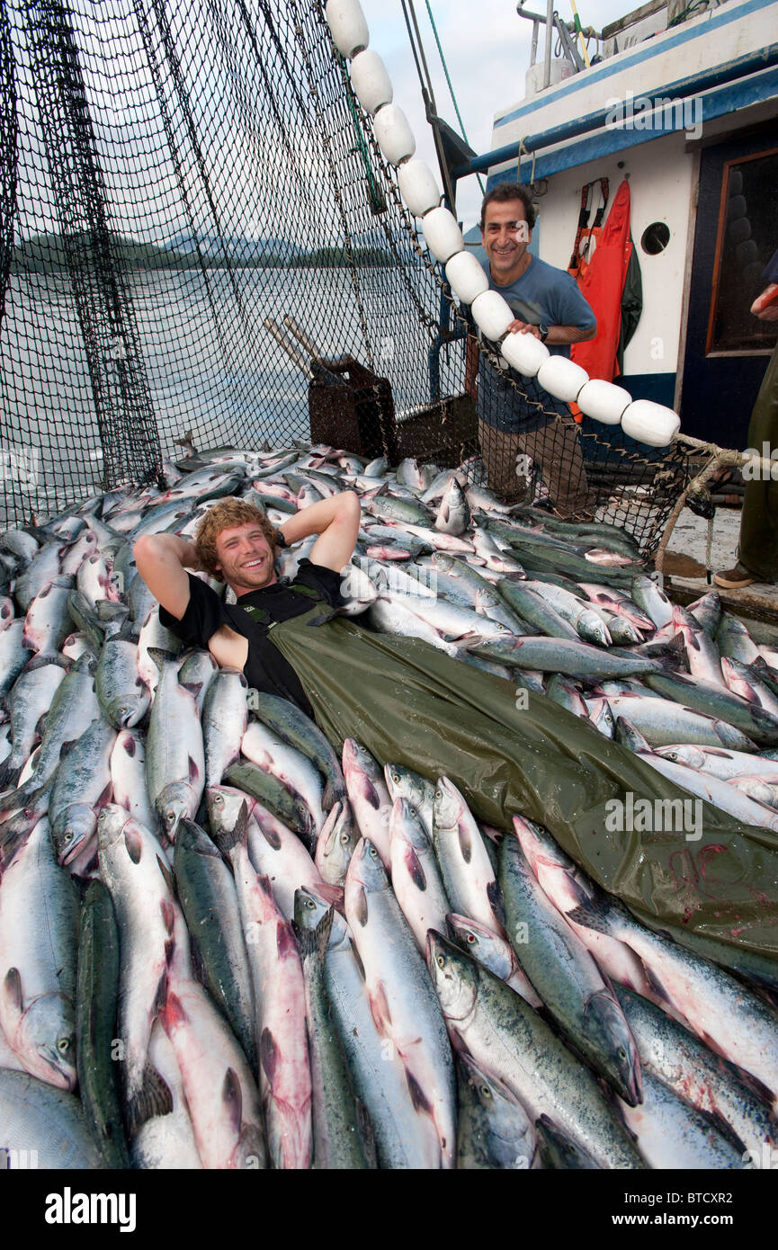 Prince William Sound, Alaska. Happy fisherman with a catch of a hundred  thousand pounds of salmon Stock Photo - Alamy