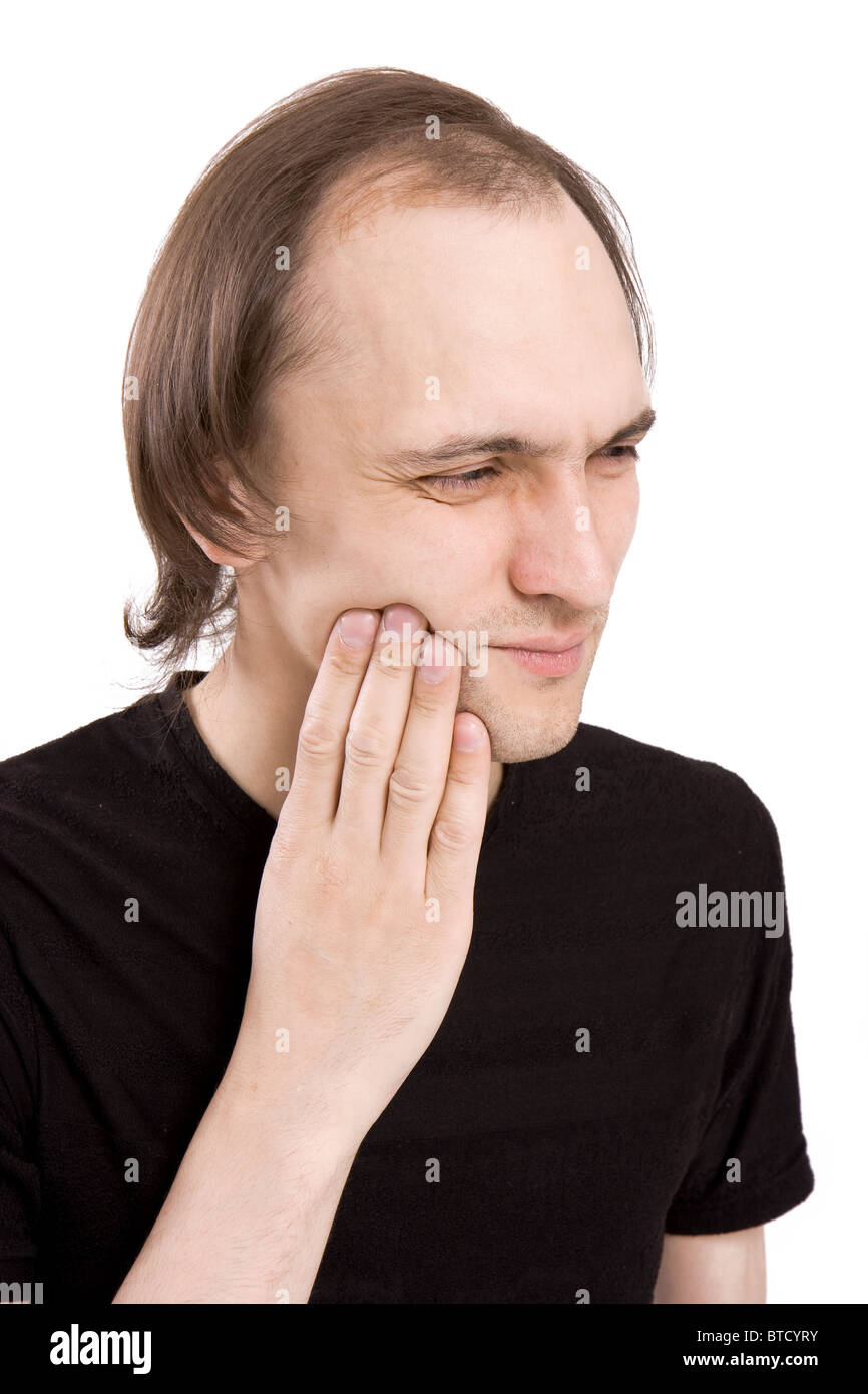 The man keeps a hand for a cheek Stock Photo