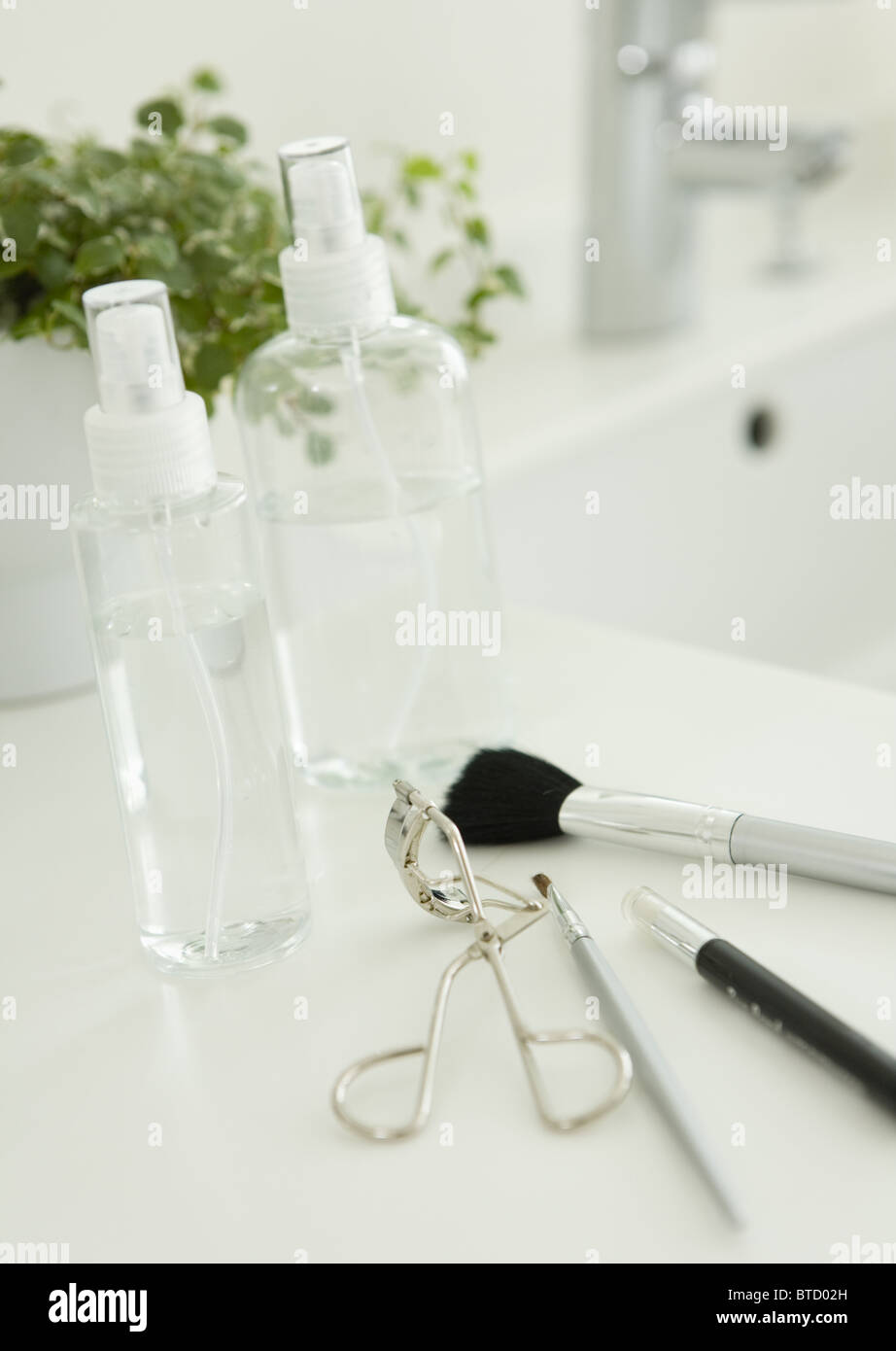Spray bottles and makeup kit Stock Photo - Alamy