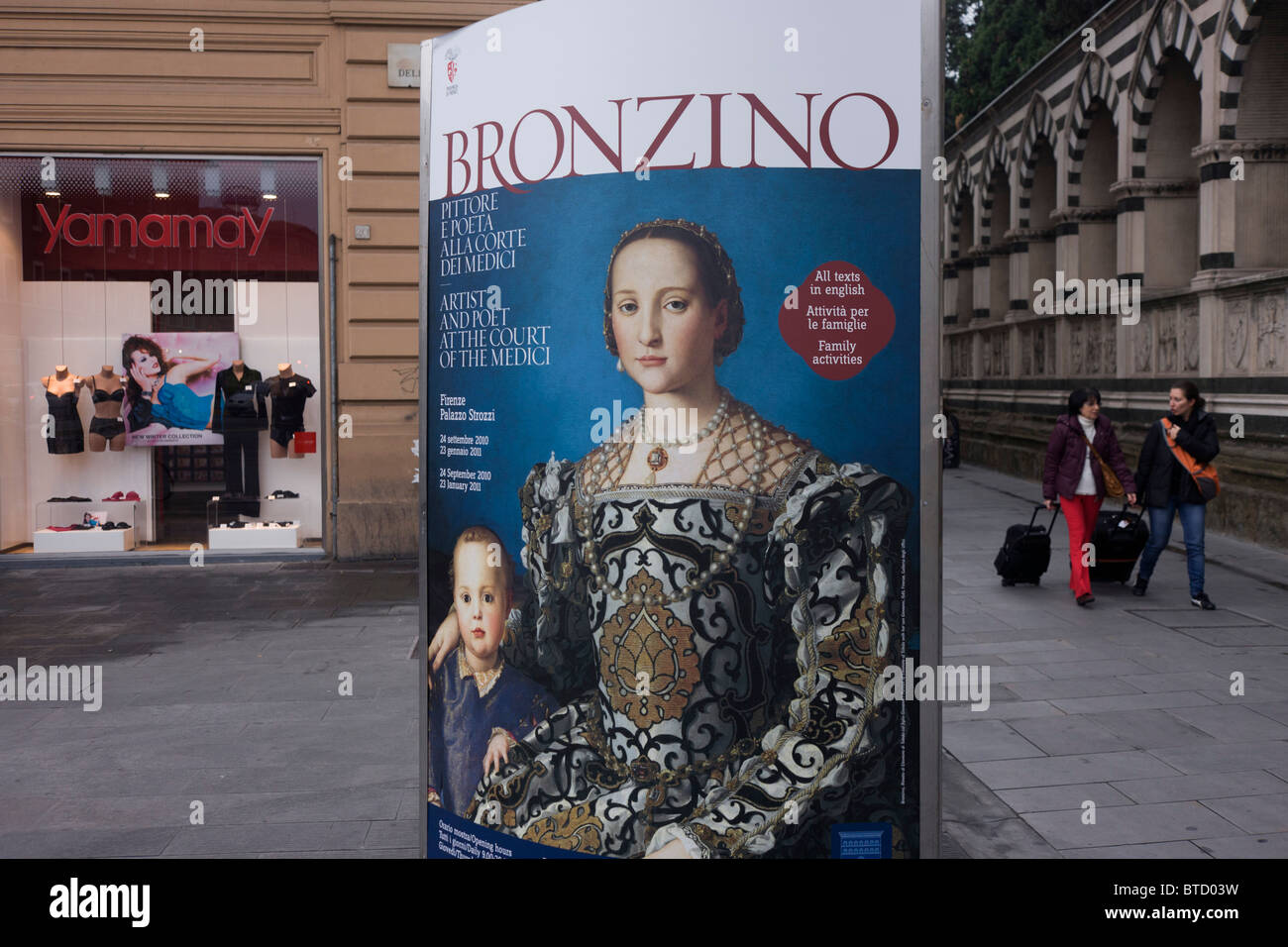 Modern Italian women and Agnolo de Cosimo Bronzino's painting of the Medici Eleanora of Toledo and son Giovanni c1545. Stock Photo