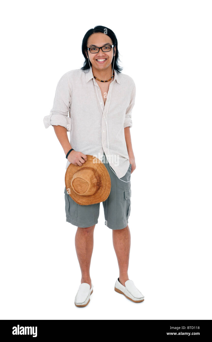 Happy young man standing against white background Stock Photo - Alamy