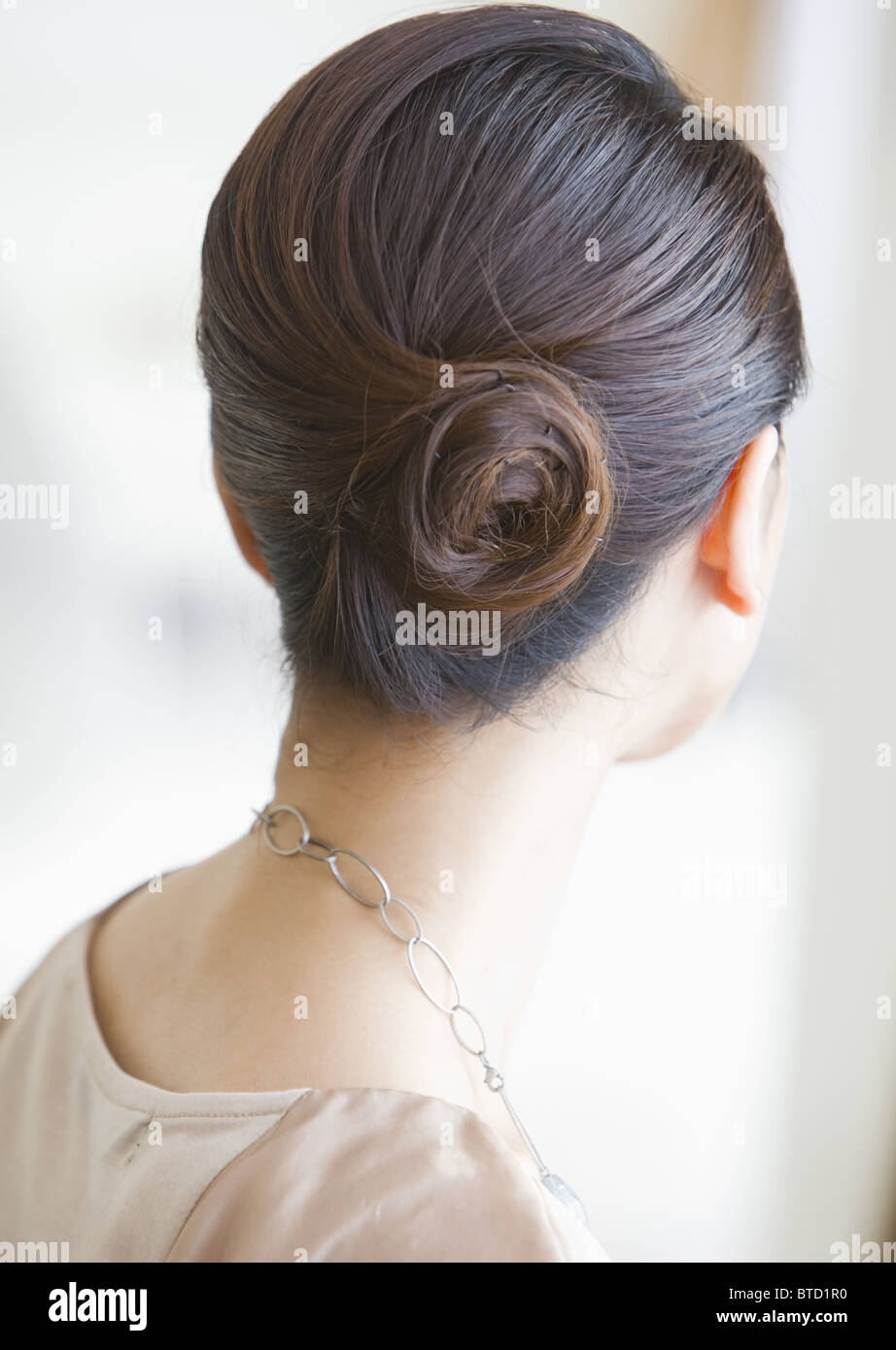 Woman with updo Stock Photo