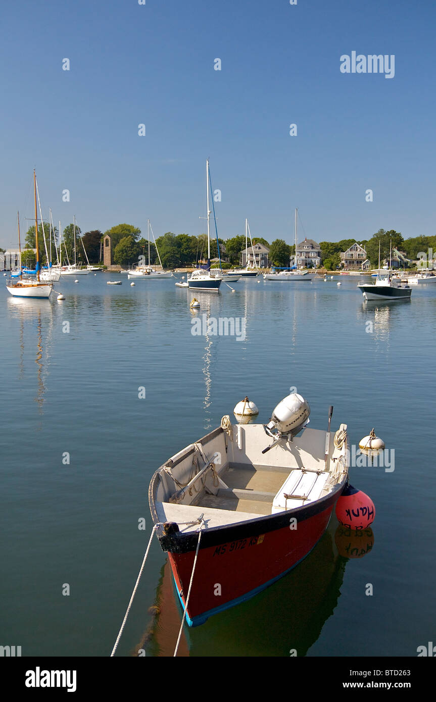 A red motorboat on the water in the Cape Cod village of Woods Hole. Stock Photo