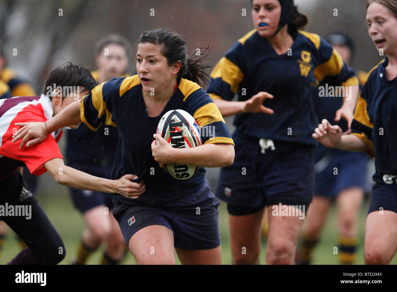 A George Washington University woman rugby player in action during a match at the annual Cherry Blossom Rugby Tournament. Stock Photo