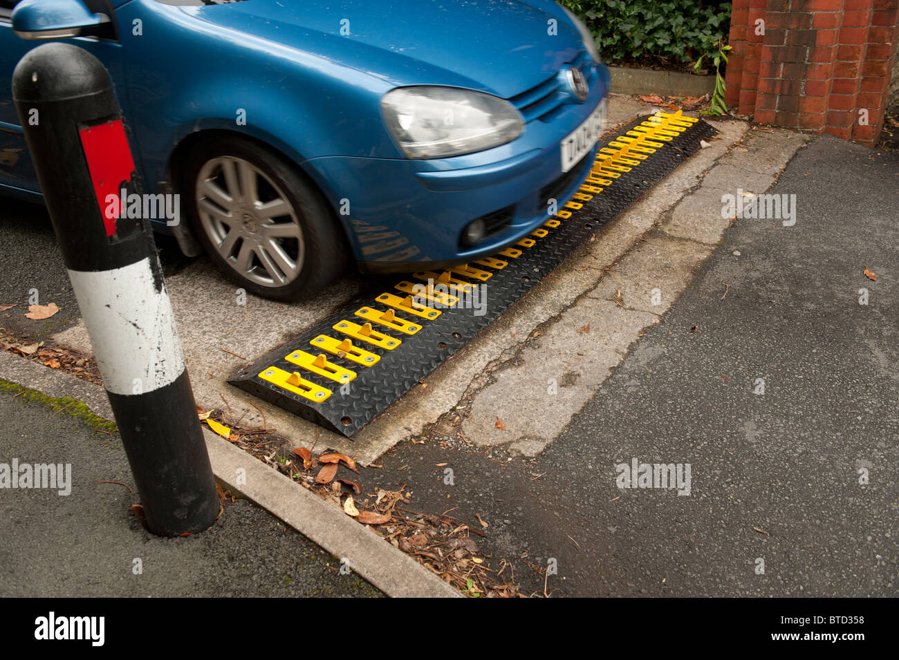 Dragon's Teeth' Traffic control measure regulating the direction of allowed travel, car park exit, UK Stock Photo