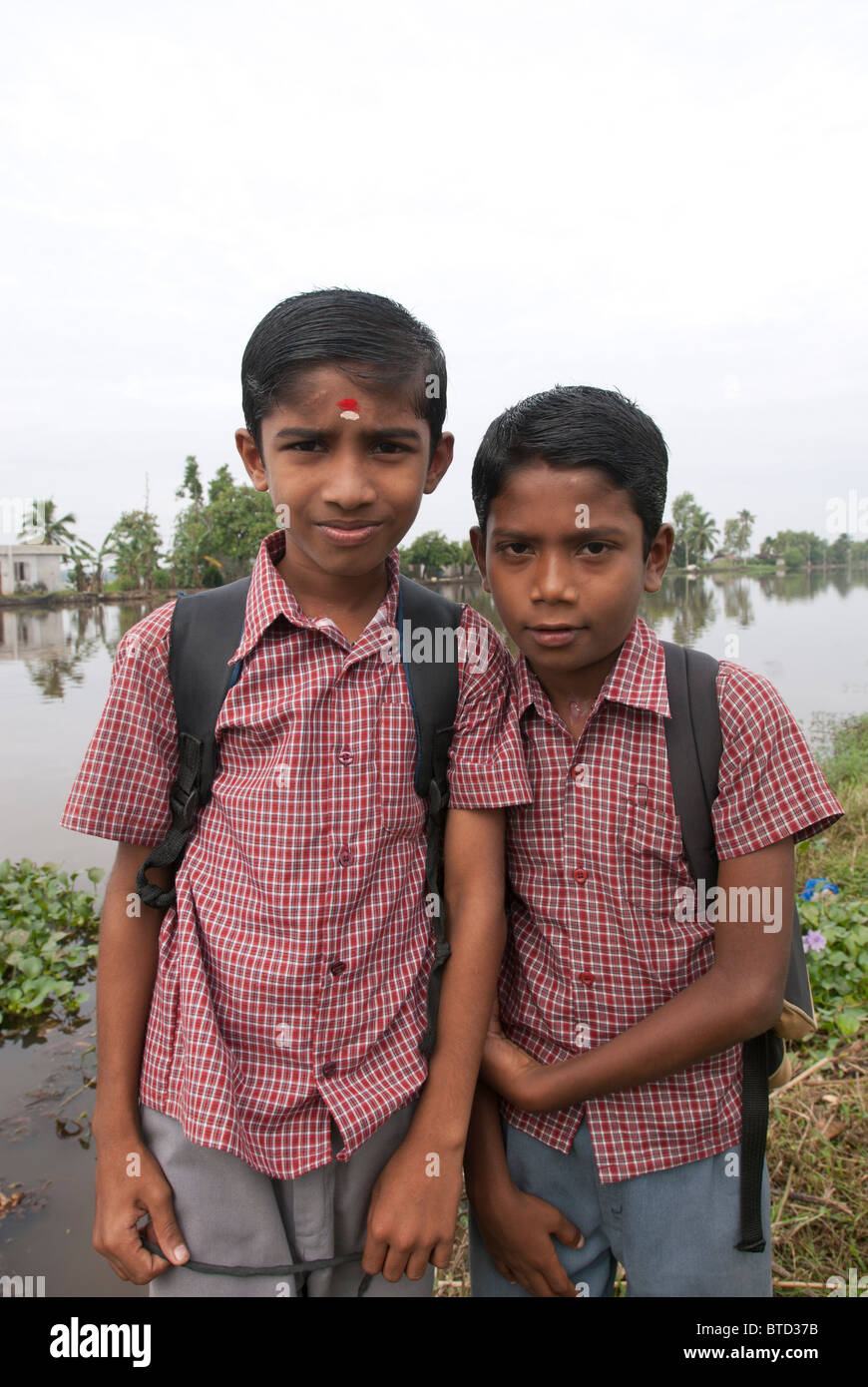 Children waiting to go to school, Alappuzha, Kerala, India. Stock Photo