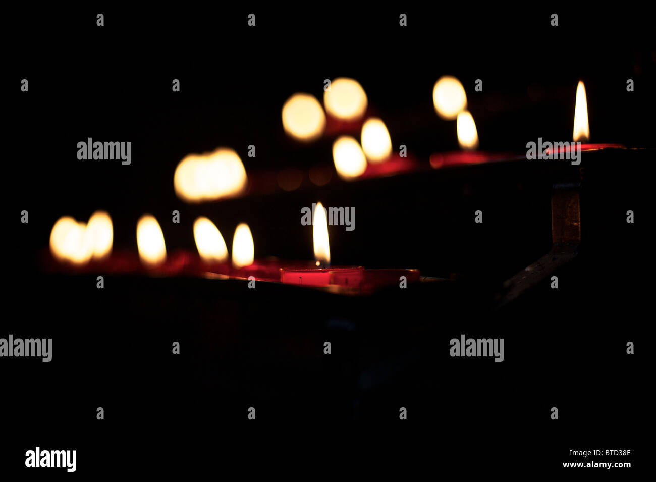 lit prayer candles Stock Photo Alamy
