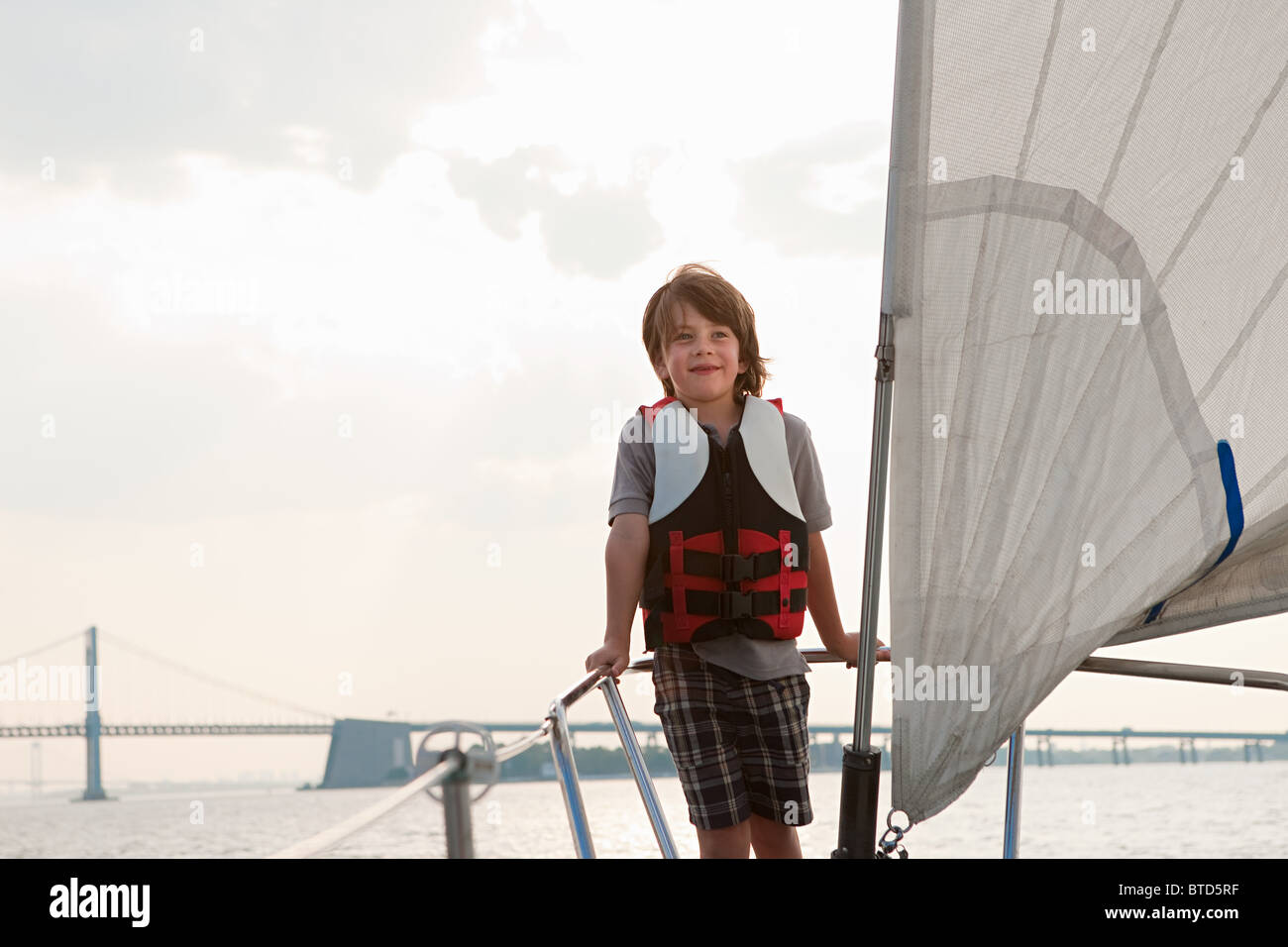 Young boy on board yacht Stock Photo