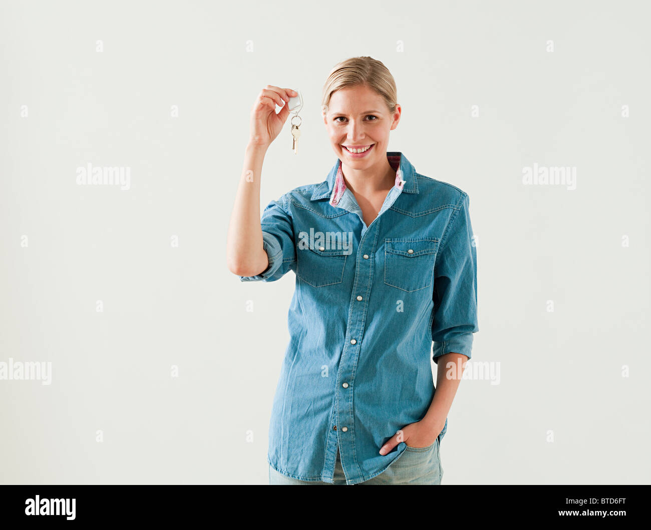 Young woman holding house keys Stock Photo - Alamy
