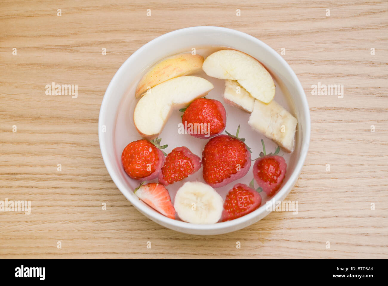 Fruit in a bowl Stock Photo - Alamy