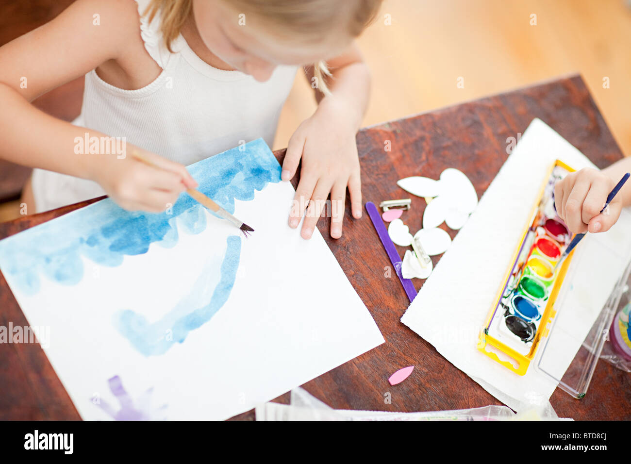 Girl painting with watercolors Stock Photo - Alamy