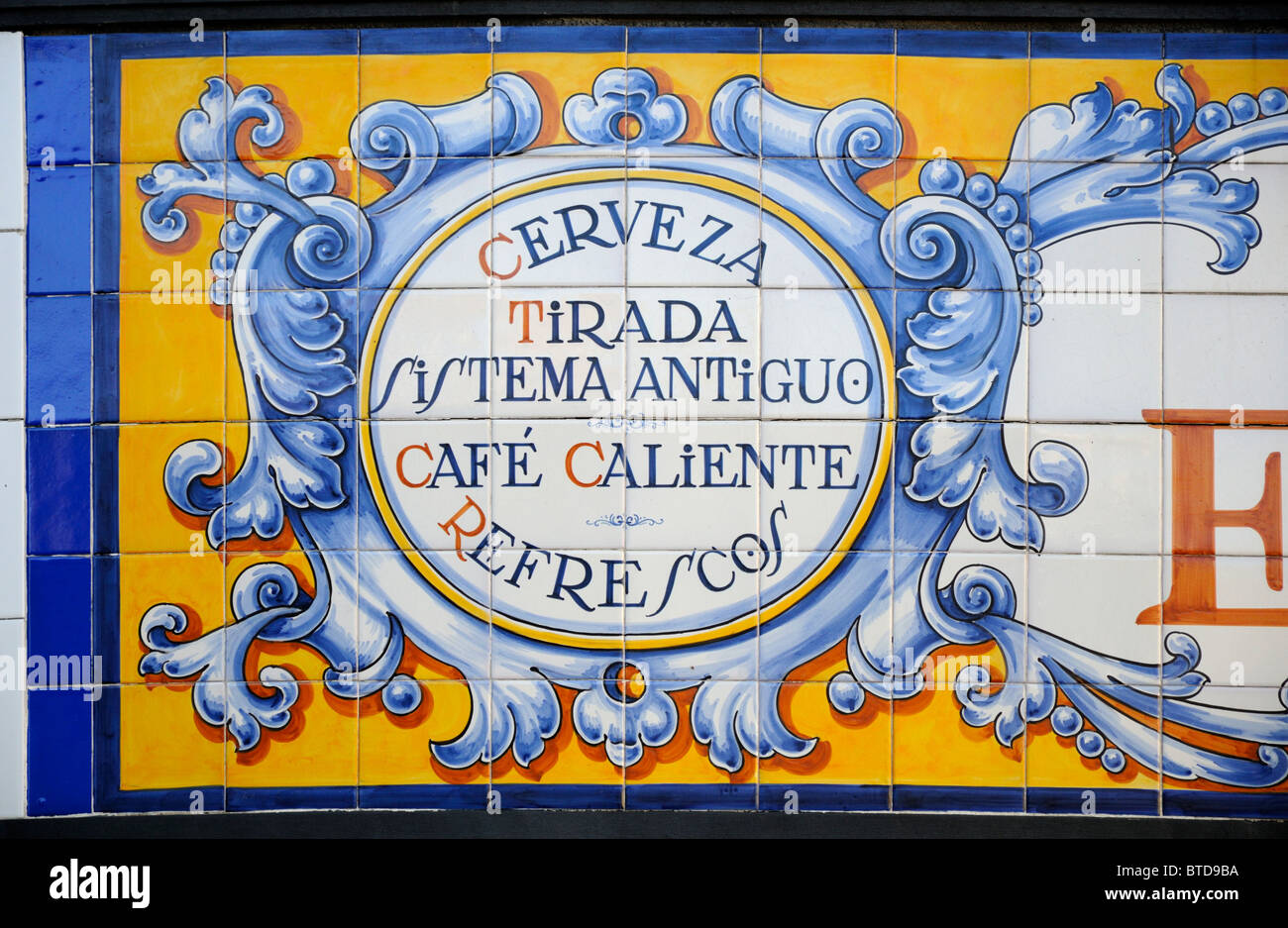 Madrid, Spain. Painted tiled cafe sign advertising beeron draught, hot coffee, refreshments Stock Photo