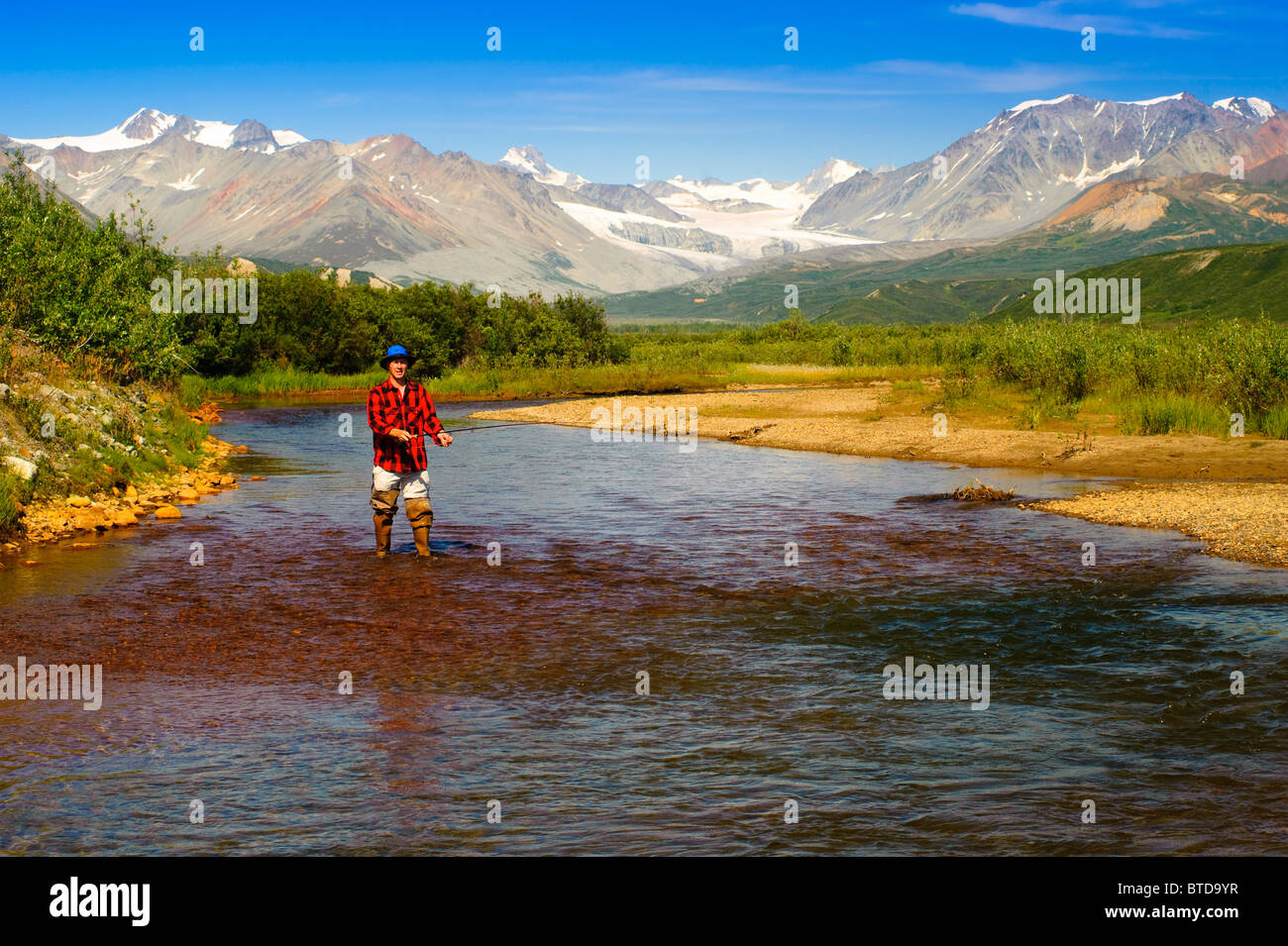 Man fly fishing in Gunn Creek off the Richardson Highway with Gulkana