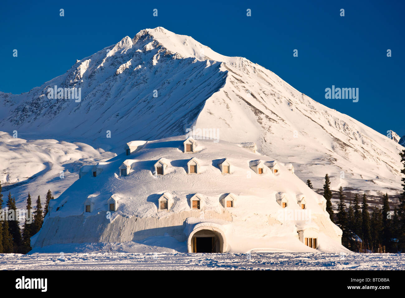 Winter view of Igloo City, a uniquely Alaskan architectural icon located along the George Parks Highway near Broad Pass, Alaska Stock Photo