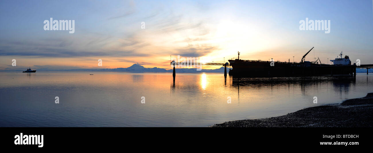 Sunset view of a Russian oil tanker off loading oil at the Kenai Tesoro refinery Kenai Peninsula, Alaska Stock Photo