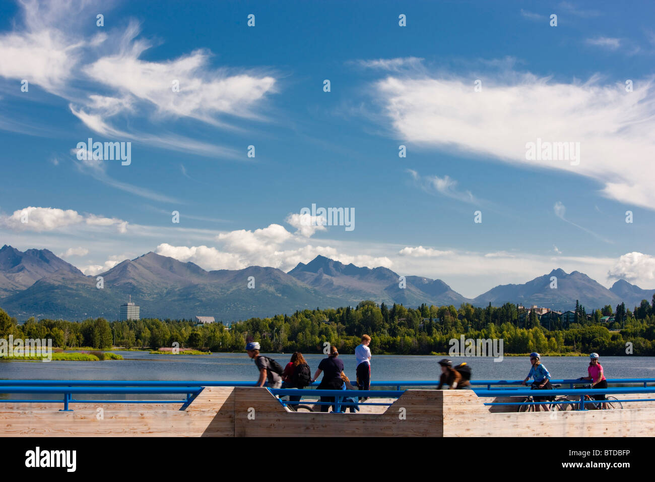 View of Westchester Lagoon with the Tony Knowles Coastal Trail fish viewing platform in the foreground during  Anchorage, Alaska Stock Photo