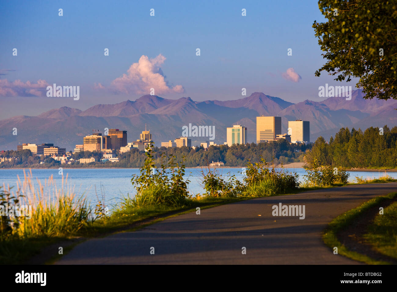 View of Anchorage skyline at sunset from the Tony Knowles Coastal Trail, Anchorage, Southcentral Alaska, Fall Stock Photo