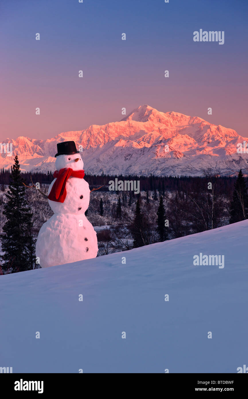 Snowman with Mount McKinley in the background at sunrise, Denali State Park, Alaska, Winter Stock Photo