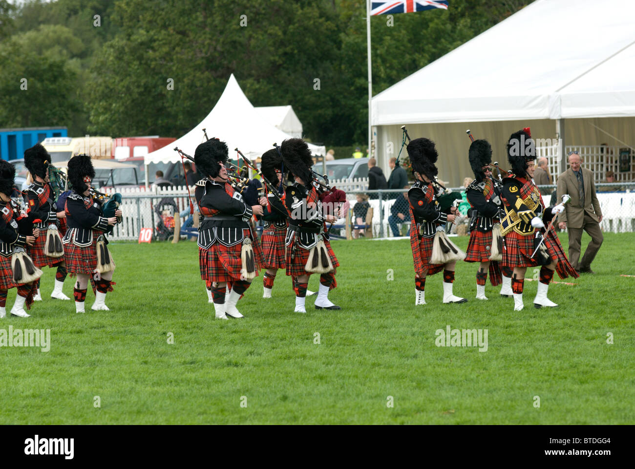 The Oatlands Pipe Band perform in the main ring at the Edenbridge and Oxted Agricultural show at Lingfield in Surrey Stock Photo