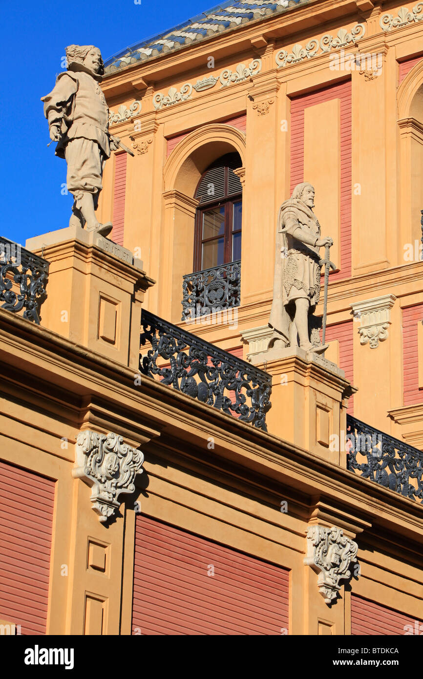 Statues of Velazquez and Ponce del Leon atop the facade of Palace of San Telmo in Seville, Spain Stock Photo