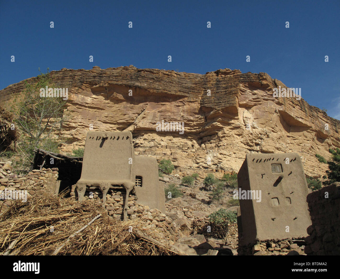 Cliff dwellings along the base of the Bandiagara escarpment Stock Photo