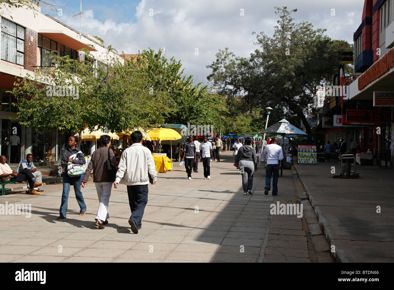 People walking in the Old Main Mall in the City centre of Gaborone Stock Photo