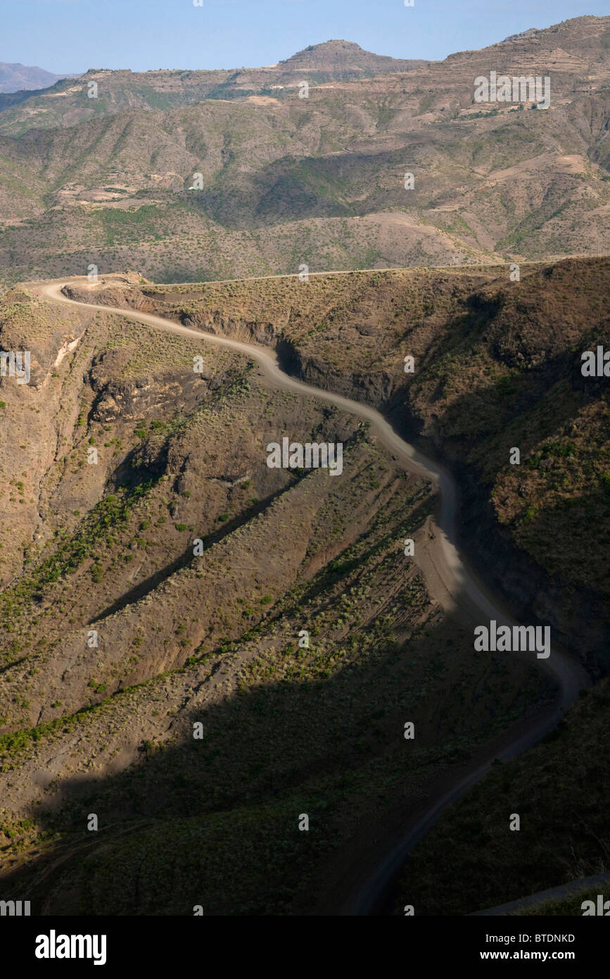 A dirt road climbing steeply up the mountainside towards Lalibela Stock Photo