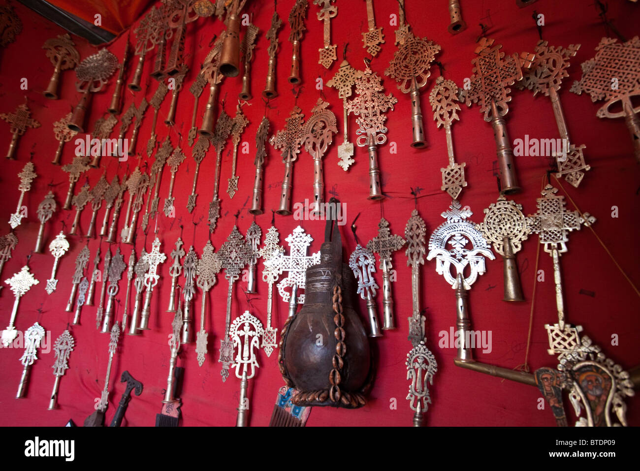 A selection of sliver St George's cross fittings for the top of walking sticks for sale in a curio stall in Lalibela Stock Photo