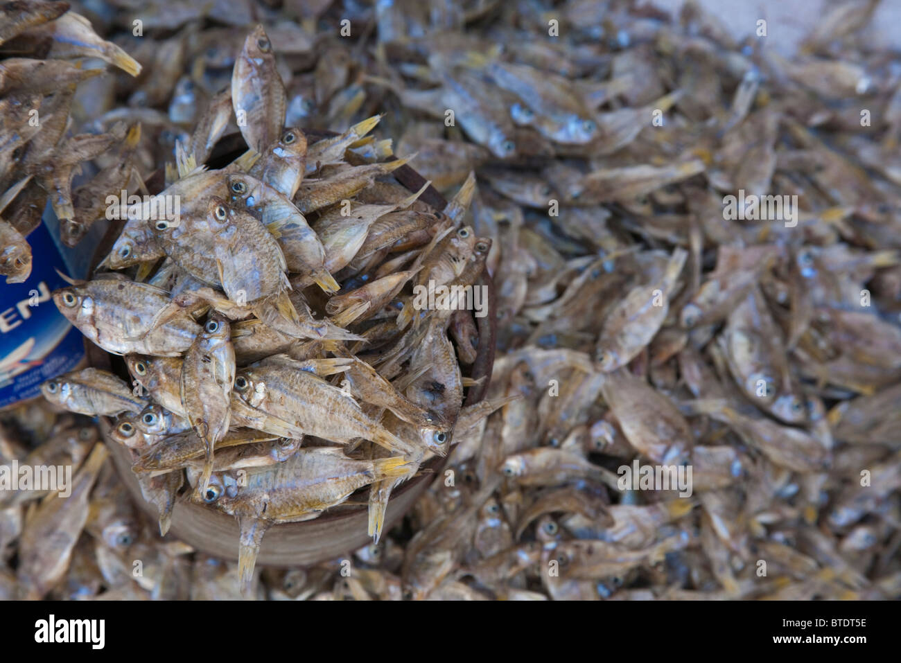 Close-up view of large quantity of small dried fishes for sale Stock Photo