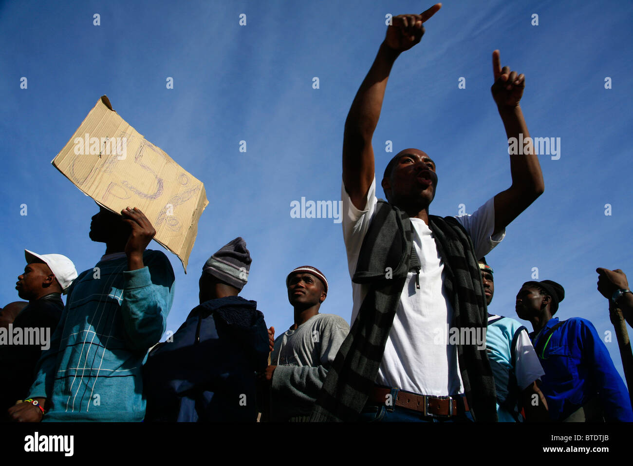 Workers on strike for higher wages Stock Photo
