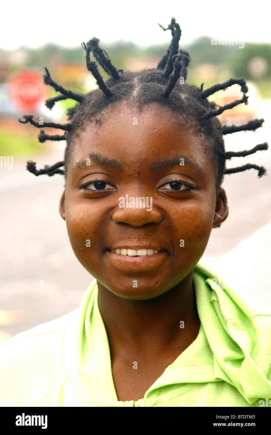 Portrait of a smiling Venda woman with a spiky braided hairstyle. Stock Photo