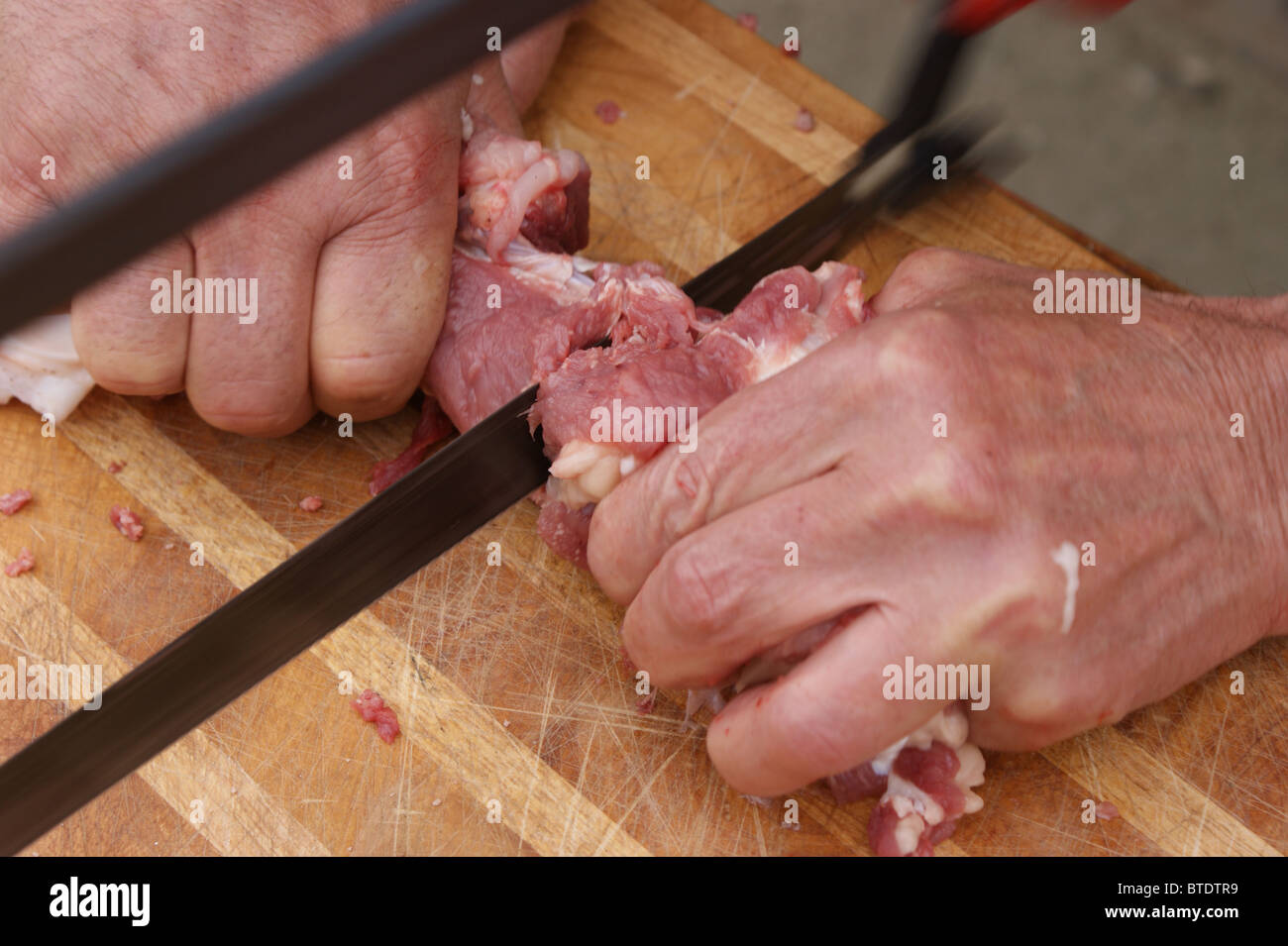 home slaughtering an growing pig in a rural area Stock Photo