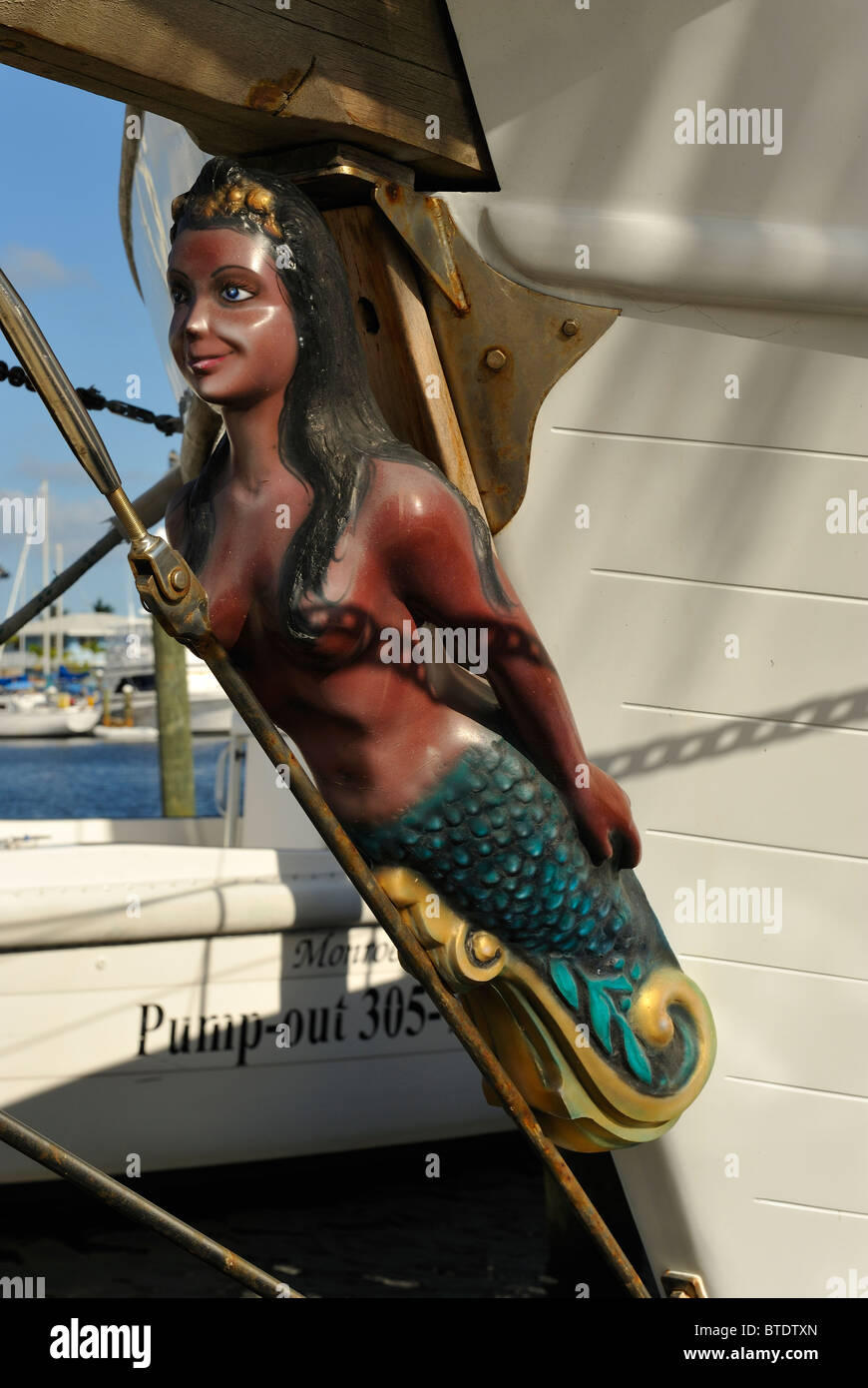 Painted wooden mermaid in the bow of a sailing boat in the marina of Key Largo, Keys islands, Florida, USA. Harbour, harbor. Stock Photo