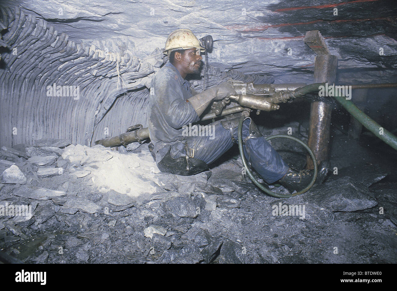 Drilling in an underground gold mine showing the cramped working