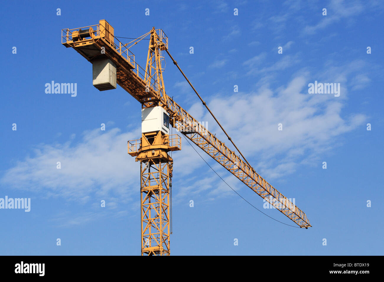 Crane against blue sky Stock Photo - Alamy