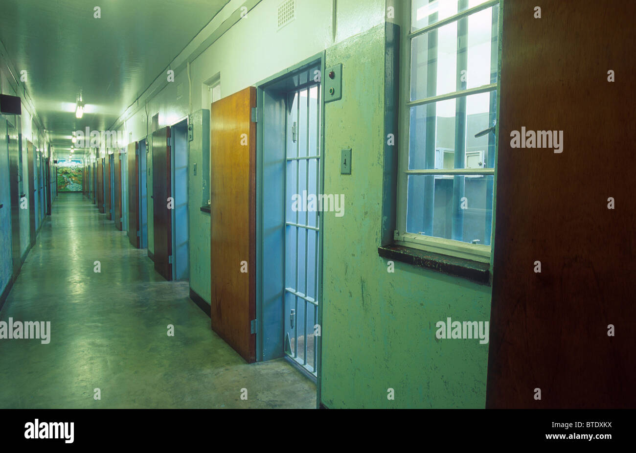 Prison cell corridor with Nelson Mandela's on the right hand side. Stock Photo