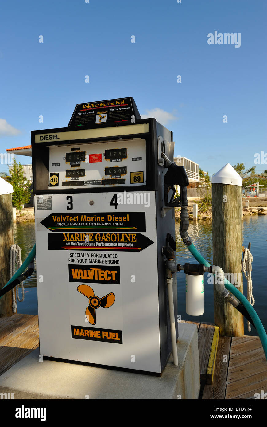 Fuel pump with a hose in the marina of Key Largo, Keys islands, Florida, USA. Harbour, harbor. Stock Photo