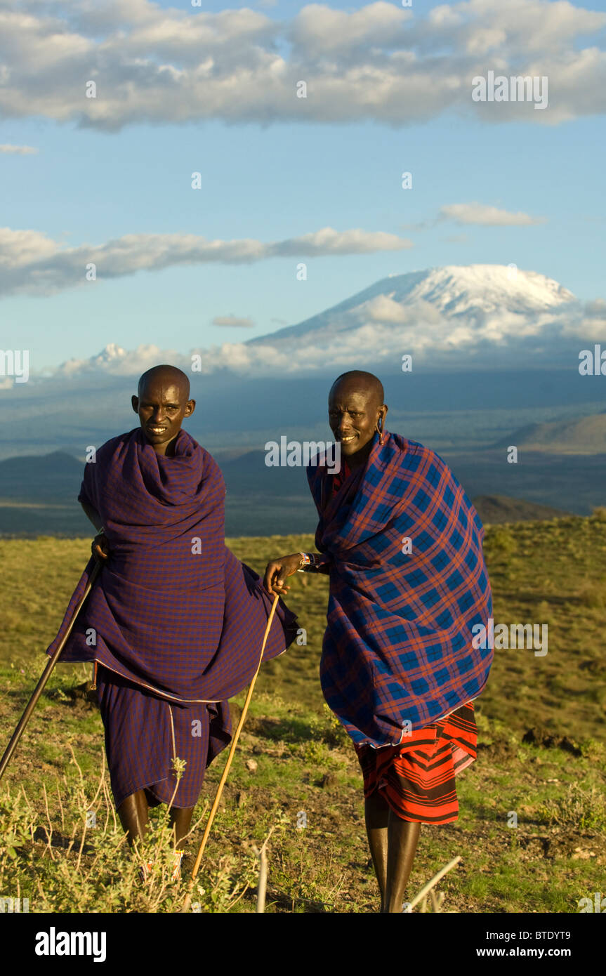 Maasai men wearing a shuka with Kilimanjaro in the background Stock Photo