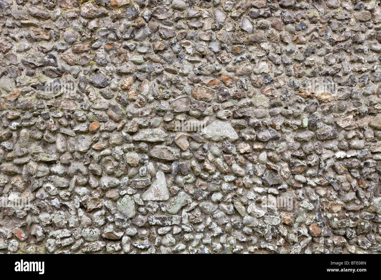 Image of a typical and traditional knapped flint stone wall in Norfolk, England, UK Stock Photo