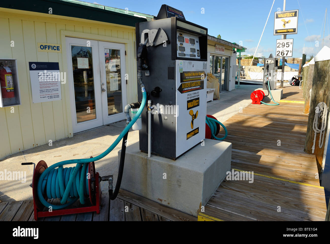 Fuel pump with a hose and boat gas station in the marina of Key Largo, Keys islands, Florida, USA. Harbour, harbor. Stock Photo